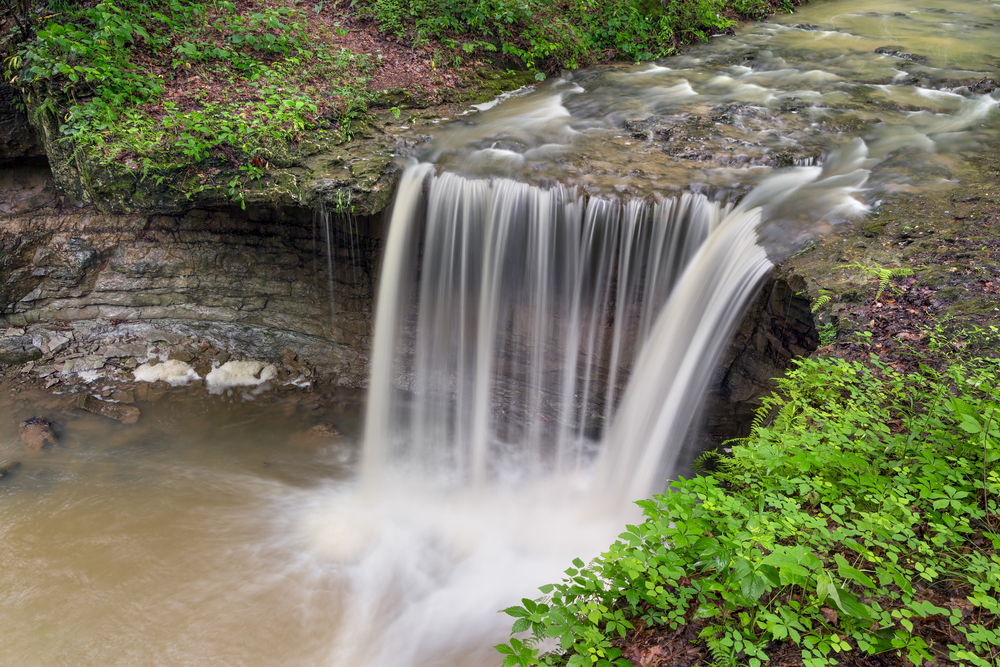 One of Indiana's lesser known waterfalls, Jennings County's Rock Rest Falls flows robustly after summer rains.